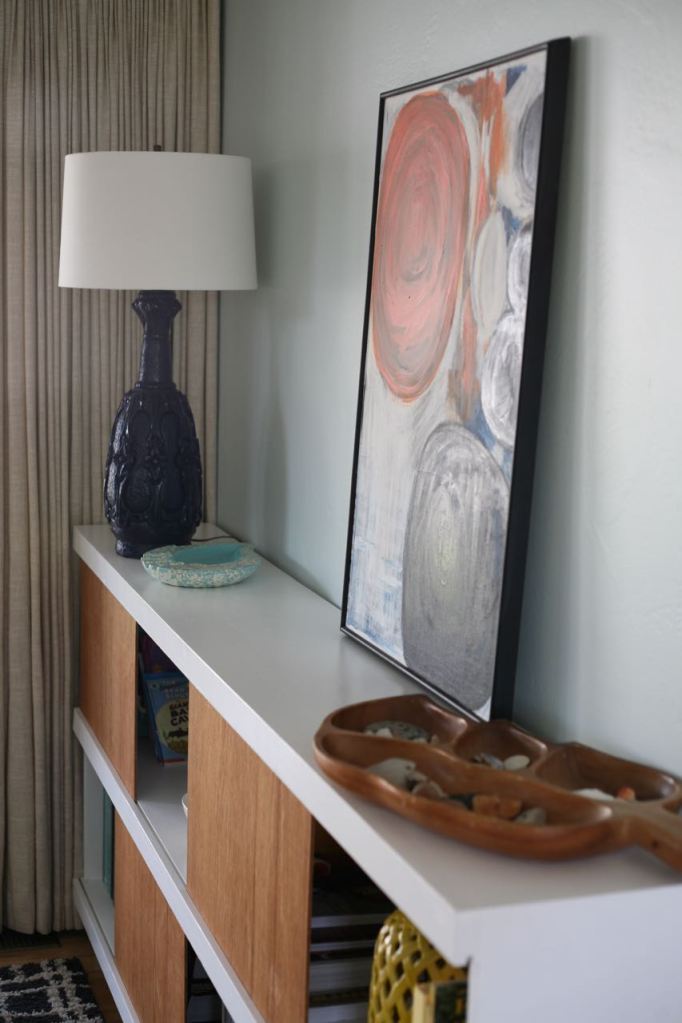 Vintage blue lamp on bookshelf