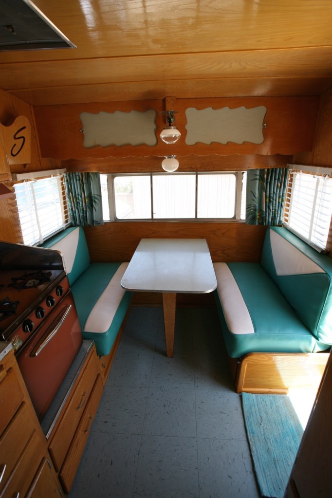 Shasta trailer vintage interior dinette vinyl upholstery barckcloth curtains blinds kitchen turquoise blue linoleum