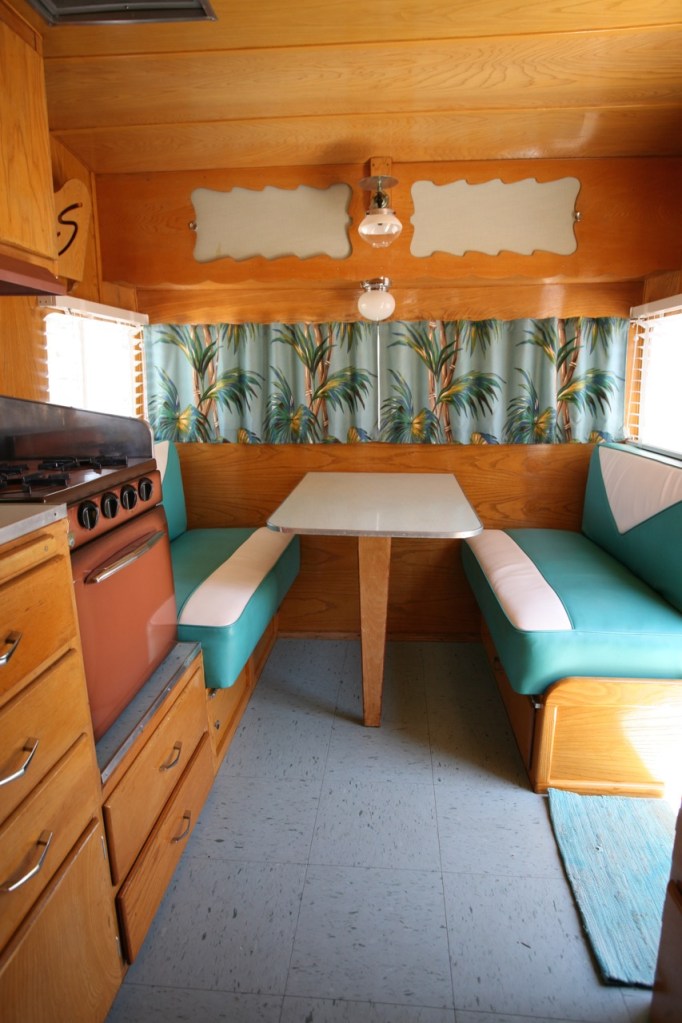 Shasta trailer vintage interior dinette vinyl upholstery barckcloth curtains blinds kitchen turquoise blue linoleum