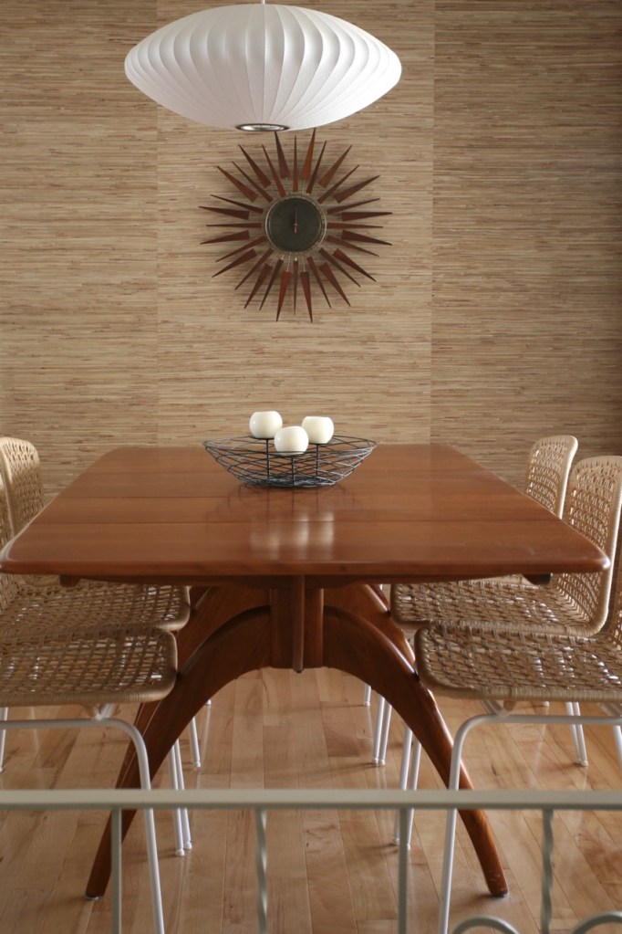 mid century dining room grasscloth wallpaper starburst clock nelson bubble light heywood wakefield wishbone table