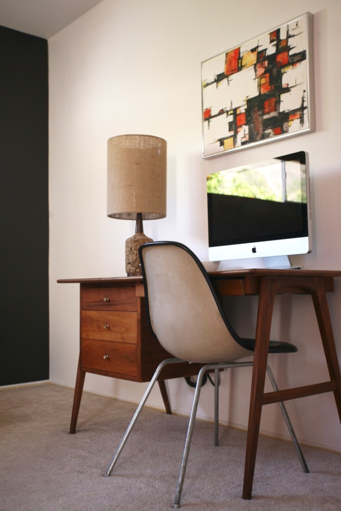 mid century modern danish desk eames chair black accent wall