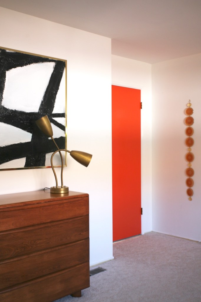 mid century modern interior bedroom orange white black