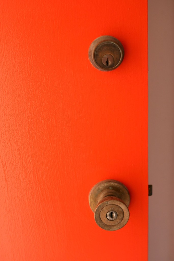 orange door mid century brass hardware behr fireglow