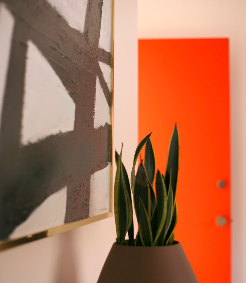 mid century interior bedroom orange black white abstract painting cb2 roz planter