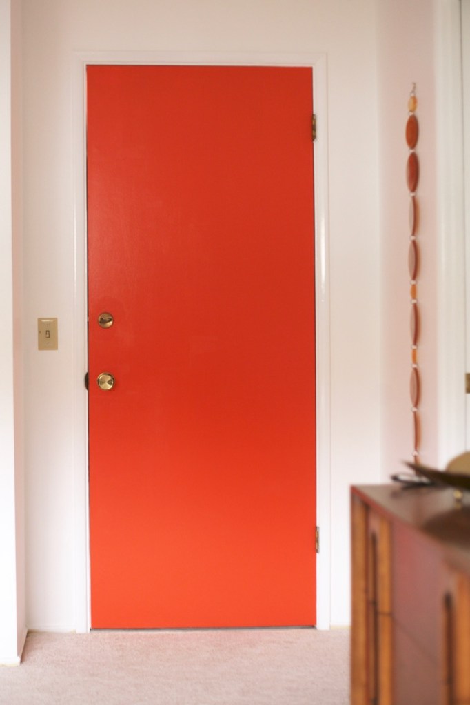 orange door mid century brass hardware behr fireglow