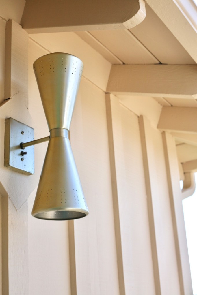mid century double cone exterior light brass