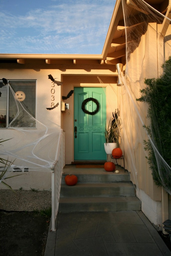 mid century modern halloween decorations front door spider webs bats