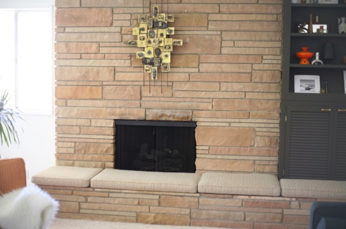 mid century rock fireplace brutalist sculpture cushions hearth