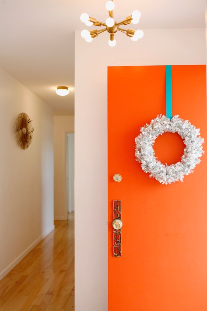 mid century orange front door christmas wreath tinsel silver retro vintage holiday christmas sputnik light