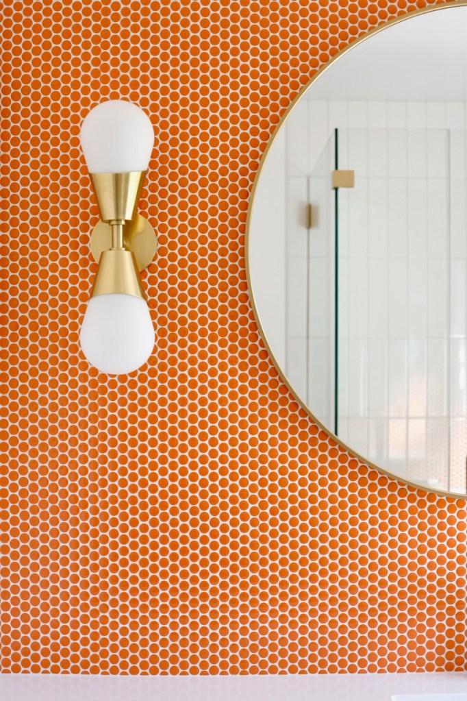 orange penny tile Festival Turmeric bathroom mid century sconce Mitzi Cora